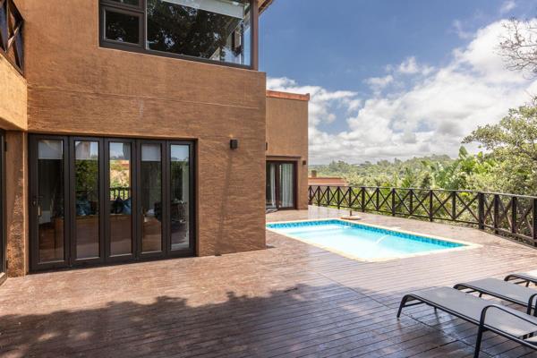 EXCLUSIVE AGENT: This modern family home offers everything you dream of in San Lameer with a panoramic view  over the estate. Nestled ...