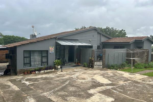 As you enter this home, fully tiled throughout and fitted with attractive aluminium doors and windows, you will be welcomed by an ...