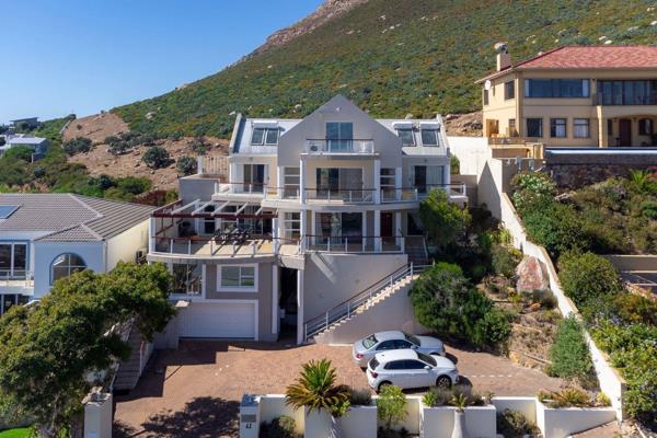 This stunning architecturally designed 3 storey home offers breathtaking north facing views of False Bay and the majestic mountains ...