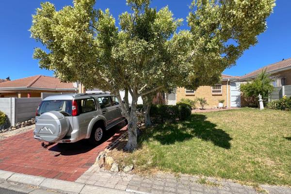 This lovely home is located on a well-known street in the heart of Protea Heights ...