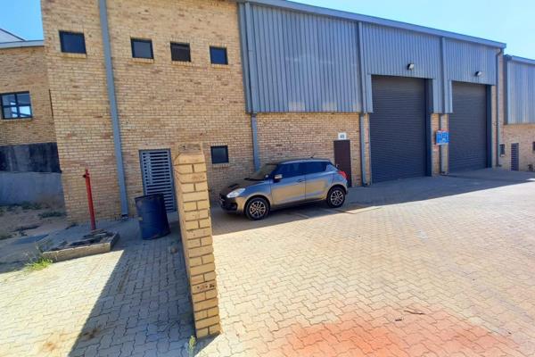 The warehouse area has two on-grade roller shutter doors, 8m height to eaves, and ...