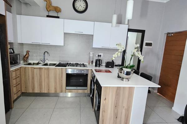 This apartment offers space, natural light and a big balcony with a built in gas braai ...