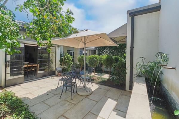 Welcome home to an amazing opportunity - peaceful courtyards with trickling water, landscaped gardens surround beautiful entertainment ...