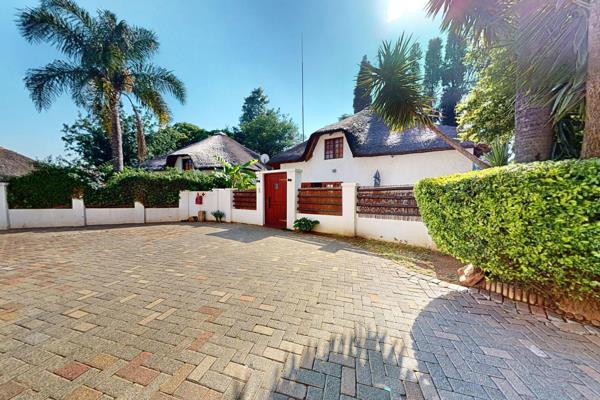 Discover this beautifully unique thatched two-bedroom home nestled within the serene ...