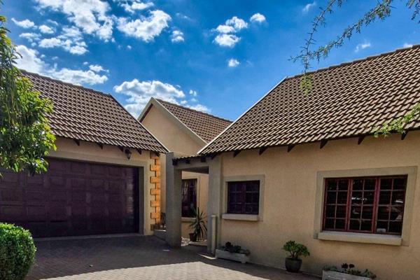 This stunning home, nestled in the secure and highly sought-after Honeydew Ridge Estate ...