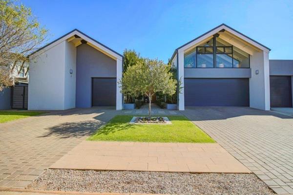 This custom-designed home epitomizes modern luxury, offering seamless indoor-outdoor living and an exceptional space for family life ...