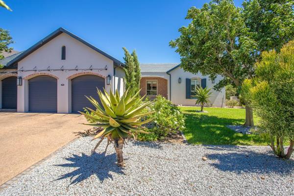 Set within the serene Val de Vie Estate, this beautifully designed single-story home ...