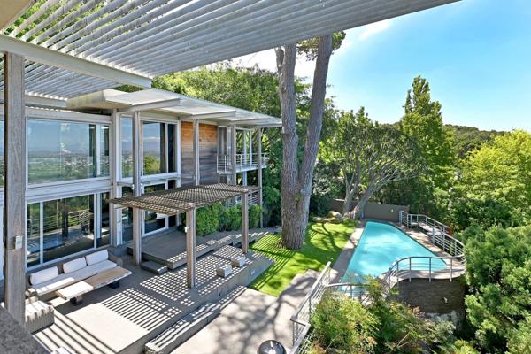 Nestled high up on the slopes of Table Mountain National Park, this exceptional property in Upper Fernwood, Newlands, offers an ...