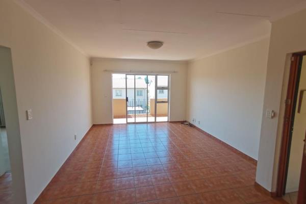 The unit has an open plan kitchen and living room giving. The living room leads out to a ...