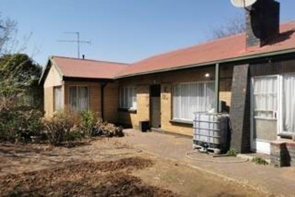 This three bedroom house with built-in cupboards and two bathrooms lounge and dining room with sunroom wooden kitchen and single garage ...