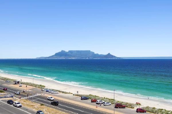 This apartment has uninterrupted views of Table Mountain, Robben Island and endless beaches. 

The living area is open plan (fully ...