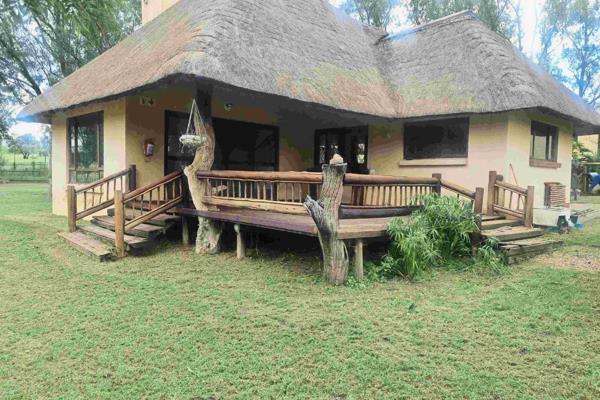 Lovely spacious double storey thatch house  - 3 bedrooms, garages, staff quarters next ...