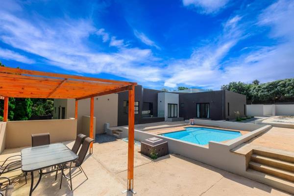 This spacious, modern house boasts a sleek, contemporary design with thoughtful touches ...