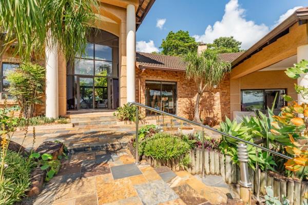 This exceptional home offers a unique blend of luxury and natural beauty, featuring ...