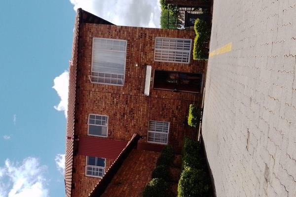 This is a two bedroom one bathroom duplex townhouse with an open plan lounge/dining area ...