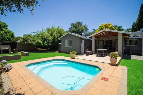 This charming home offers a spacious, relaxing lounge that flows into a cozy breakfast room, leading through sliding doors to the ...