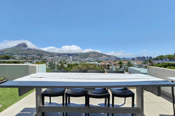 This modern corner unit has the best of both worlds. Exceptional Table Mountain Views with Lions head, signal hill and the harbour. 

2 ...