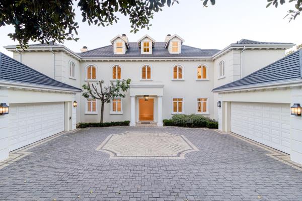 Elegance and sophistication in this grand Georgian-inspired 5-bedroom, 5.5-bathroom residence, in the prestigious suburb of Hurlingham, Sandton (within the Sandhurst Enclosure).

Nestled in an exclusive, tree-lined cul-de-sac and custom-built just over a decade ago, this ...