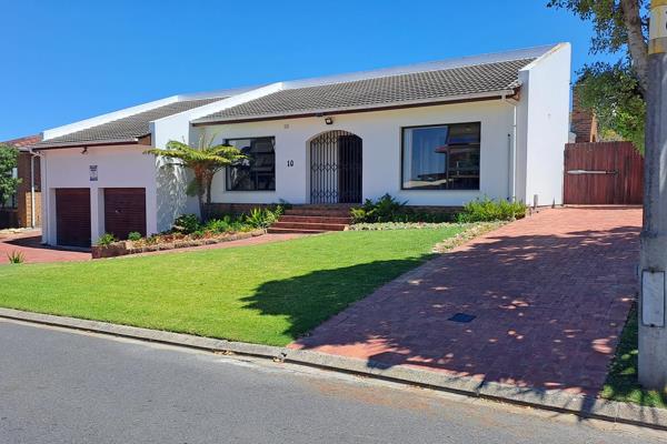 This spacious family home with aluminium window frames, solar geyser, access and extra ...