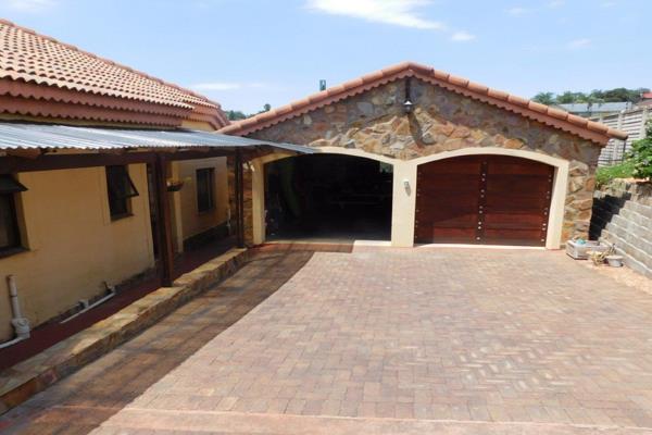 This lovely three bedroom house has an entrance portal, patios, a balcony, a braai room ...