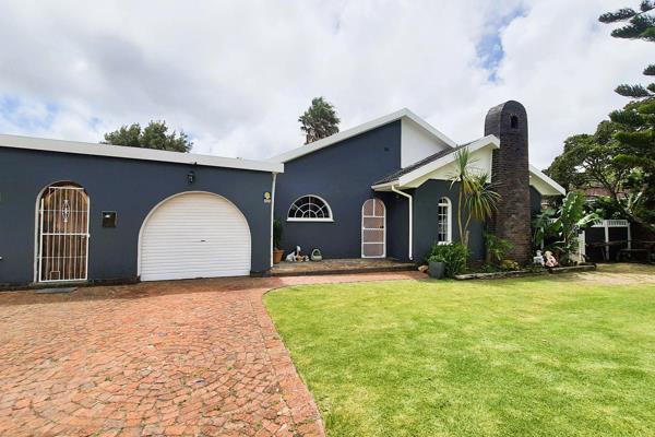 Beyond a motorized gate, this charming home welcomes you into a lush, fully enclosed ...