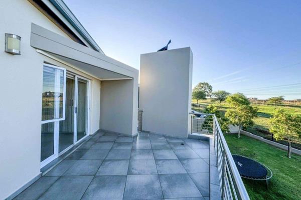 As you step through the entrance hall you enter light filled, open plan living areas with white plantation shutters adding to the ...