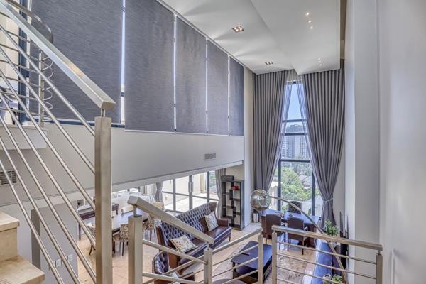 Experience the stunning penthouse in an esteemed building right next to Investec ...