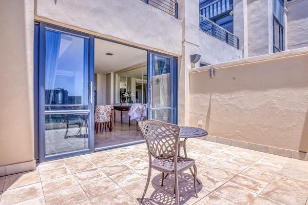 Experience the stunning penthouse in an esteemed building right next to Investec ...