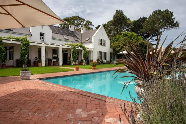 This upmarket Cape Dutch style home in the private De Goede Hoop Security Estate boasts ...