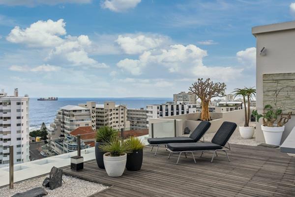 This luxurious three-bedroom penthouse in Sea Point offers breathtaking views and upscale
amenities. The open-plan living area ...