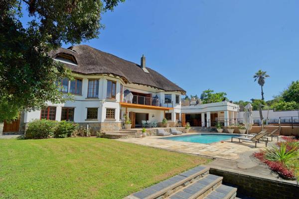 This exceptional thatch home combines contemporary design with the rustic allure of traditional thatch roofing, creating a unique and ...