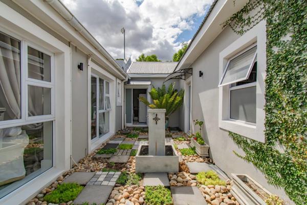 Sole and Exclusive Mandate: Nestled in the picturesque coastal town of Gordons Bay, this beautifully restored heritage home exudes ...