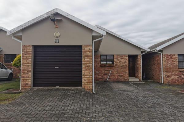 This neat townhouse offers an open plan kitchen and living area with sliding doors out ...