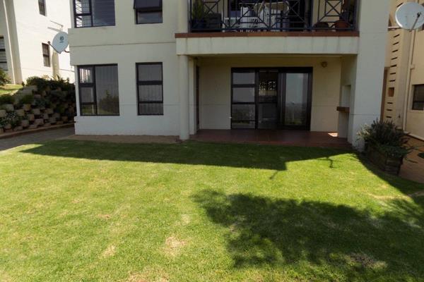 Stunning apartment in a perfect location. Patio with braai (covered) facing onto common ...