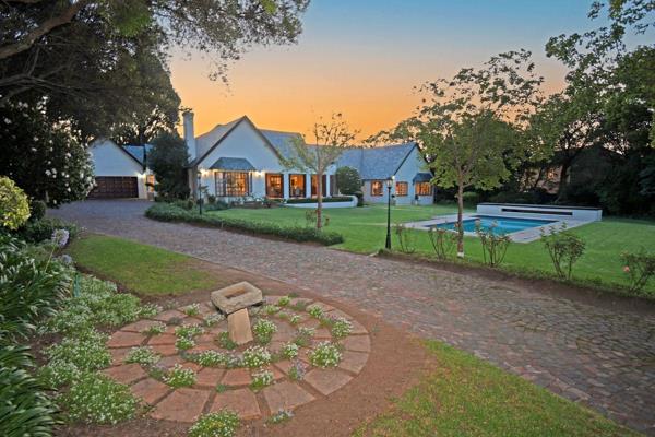 This charming Bryanston home is situated in a peaceful setting within a boomed off road.

Traditional Bryanston beauty under slate with ...