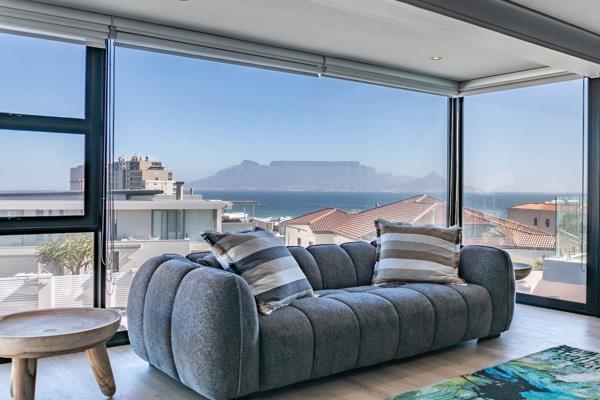 Perched high above the iconic Bloubergstrand beach, this newly rebuilt, fully furnished home offers breathtaking, uninterrupted views ...