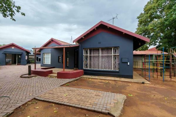 This prime property is ideally situated directly opposite Risiville Primary, offering exceptional potential for both investment and ...