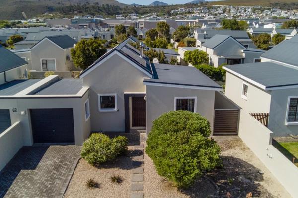 Welcome to this beautifully maintained 2-bedroom, 1-bathroom home in the desirable Ocean Breeze estate in the beautiful Sandbaai area in Hermanus, perfect for holiday getaways. 

The inviting living area boasts high, pitched ...