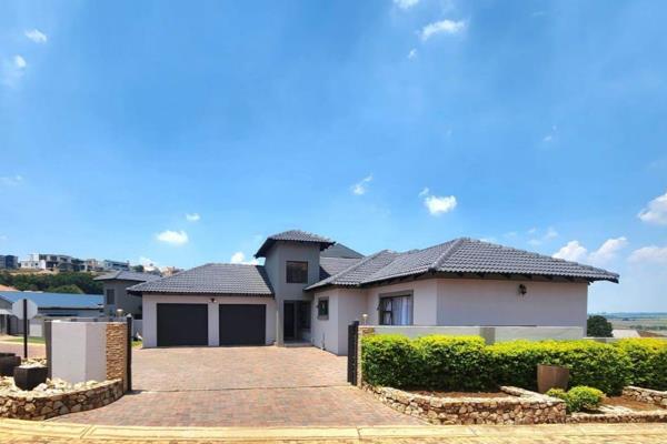 Enjoy luxury living in this stunning six-bedroom home within a secure estate. The spacious living areas open onto a patio with ...