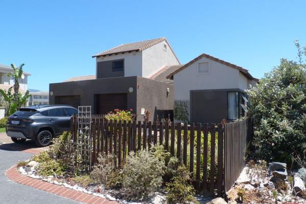 Lovely open plan living room with doors to a patio area and garden.  Kitchen with plumbing for a dishwasher and access to the single ...