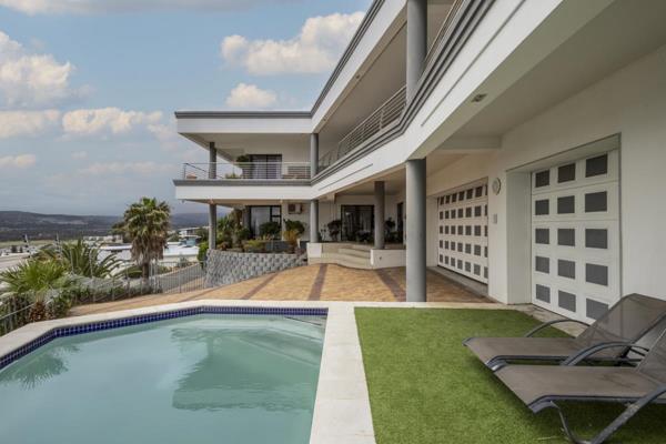 Located in the scenic Mountain Side area of Gordons Bay, Western Cape, South Africa, the home spans 882 m and sup2; of land and ...