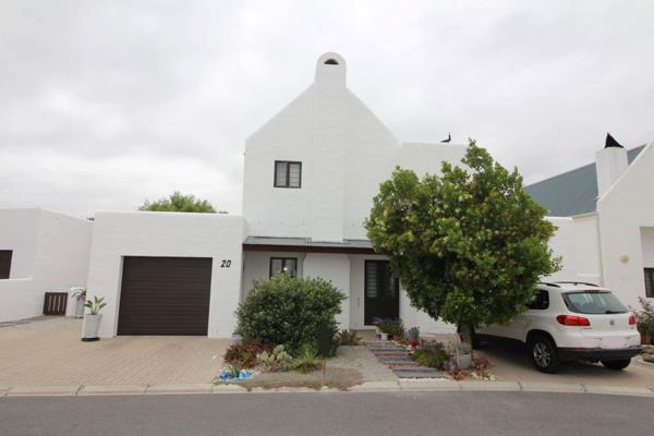 This modern double-story home is the perfect coastal retreat for a retired couple or ...