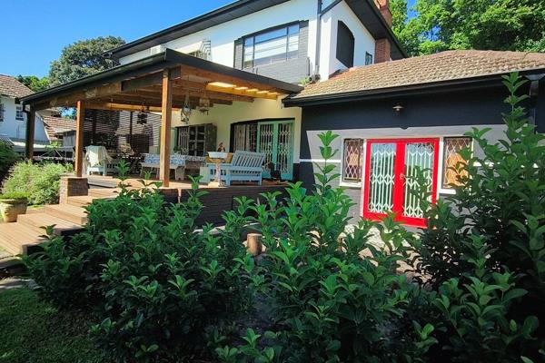 Step inside to discover a cozy office that leads out to a deck offering serene views of the sparkling pool. 
Delight in the inviting ...