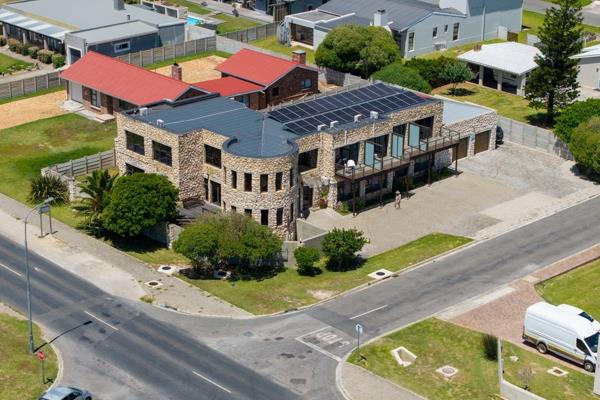 Introducing a stunning sandstone building located at the entrance of Struisbaai ...