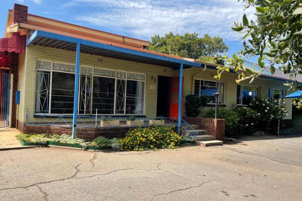 This property was previously used a daycare so most of the rooms inside have been modified:
Kitchen with few built-in cupboards and ...