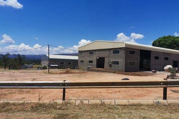 Double volume warehouse on the R24, appr. 5 kms from the mall, with loads of parking space, easy access for links, very neat open plan ...