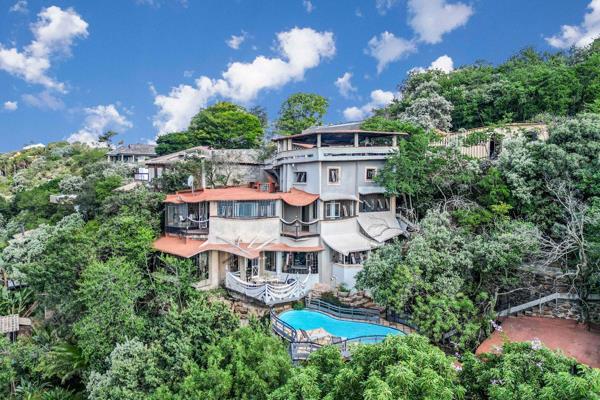 Built into the mountainside of Linksfield Ridge, this one-of-a-kind home blends seamlessly with its natural surroundings, incorporating ...