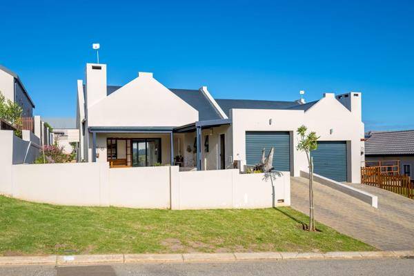 This home has an impressive open-plan design that seamlessly blends style and serenity. At its heart the functional kitchen, with ...