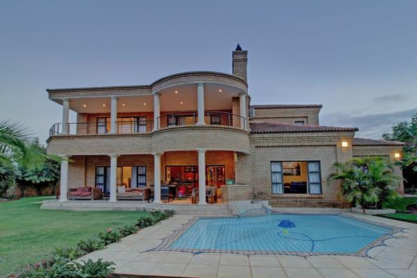 Welcome to this exceptional family home, nestled within the prestigious Woodhill Golf Estate. A true masterpiece, this residence offers ...