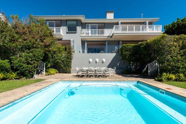 This contemporary coastal home is designed with open spaces, natural light, and a ...